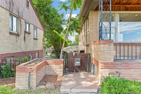 a brick house with a large windows