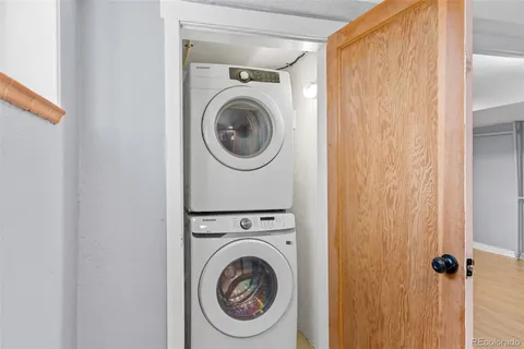 a view of a hallway with washer and dryer