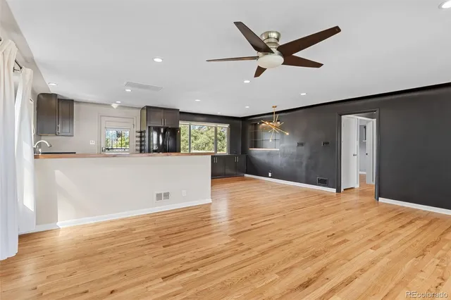 a view of a livingroom with a kitchen