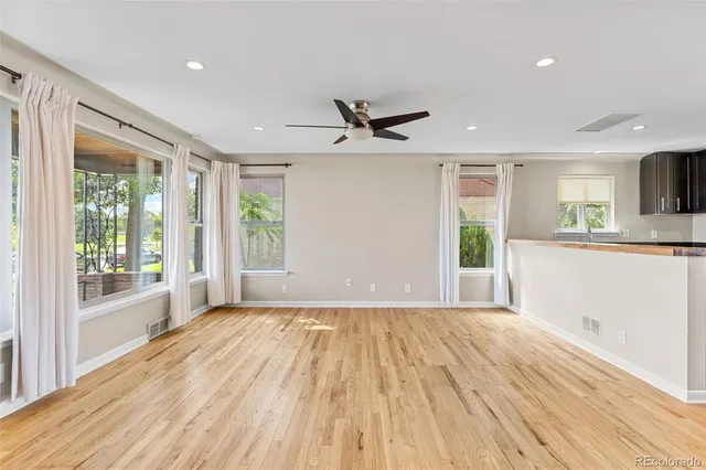 a view of a kitchen with a sink and a window