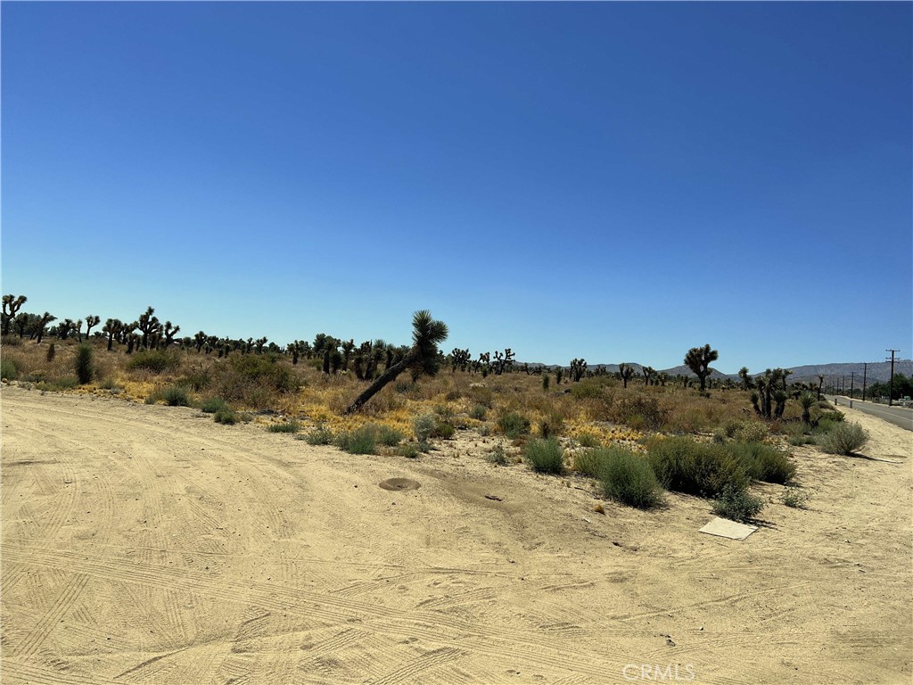 10738 Sheep Creek Road Phelan, CA 92371 - Photo 14 of 20 a view of top of a building and snow on the road
