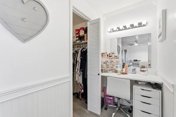 a bathroom with a sink vanity and a mirror