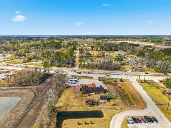 an aerial view of residential houses with outdoor space