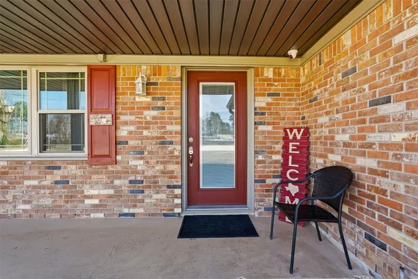 a front view of a house with outdoor seating