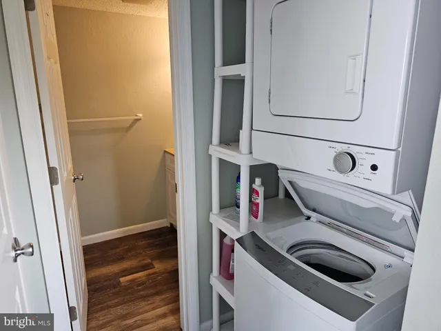 a bathroom with a sink and a washer dryer