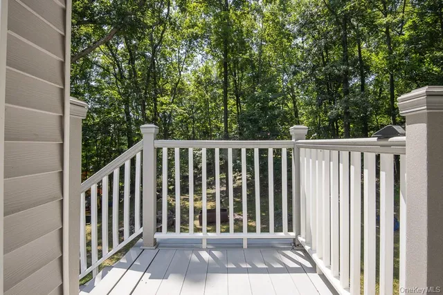 a view of balcony with wooden floor