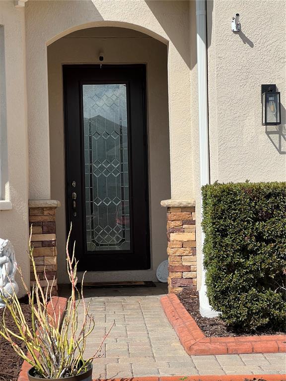 4419 Azure Isle Way Kissimmee, FL 34744 - Photo 2 of 39 a view of a entryway door of the house