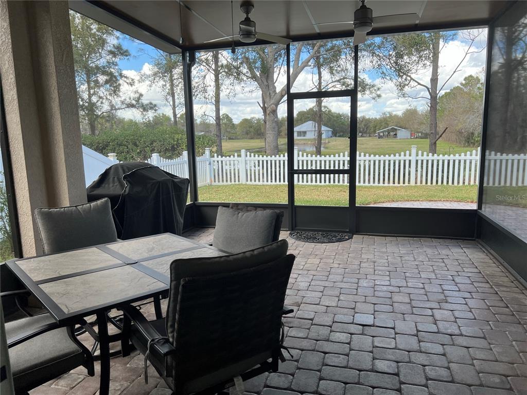 4419 Azure Isle Way Kissimmee, FL 34744 - Photo 26 of 39 a view of a dining room with furniture and a window