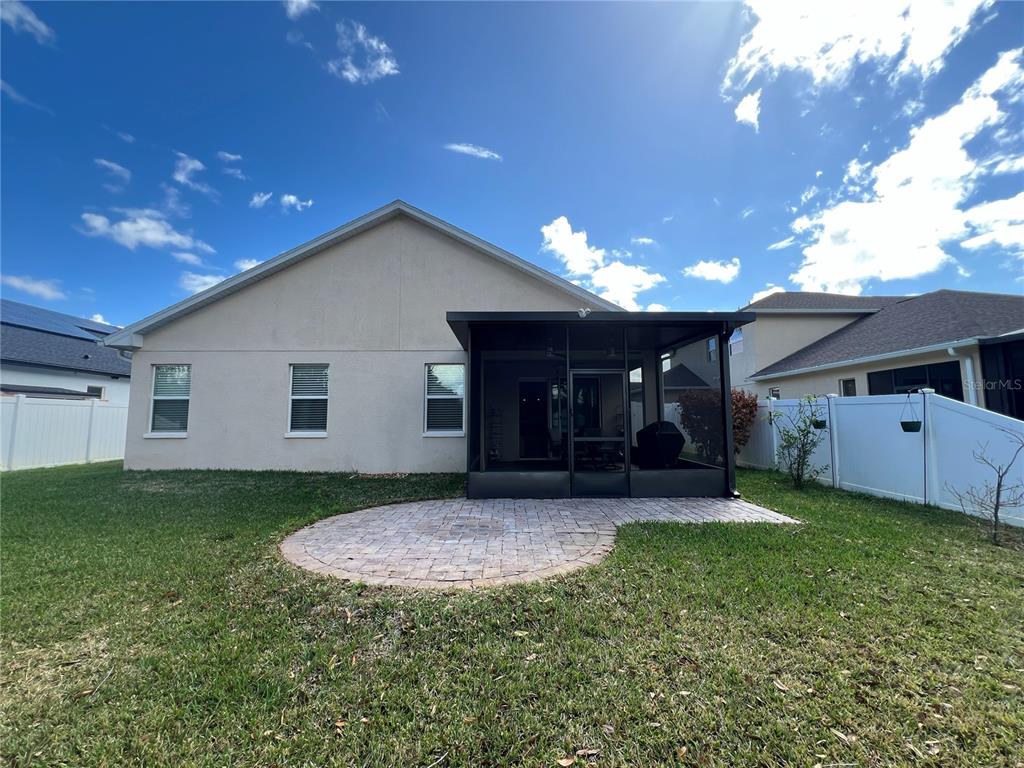 4419 Azure Isle Way Kissimmee, FL 34744 - Photo 30 of 39 a view of a house with a yard and porch