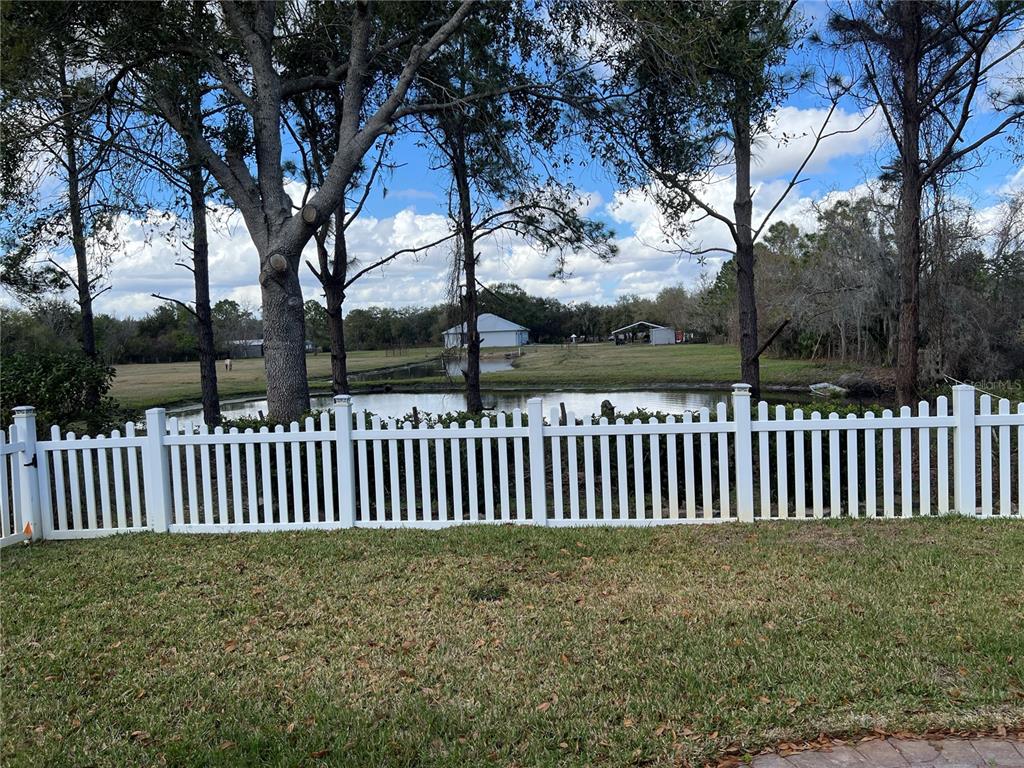 4419 Azure Isle Way Kissimmee, FL 34744 - Photo 32 of 39 a view of a bench in the garden