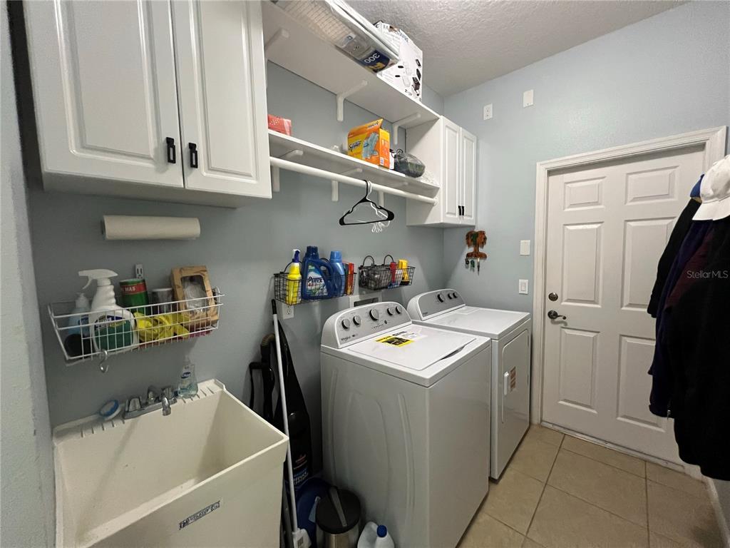 4419 Azure Isle Way Kissimmee, FL 34744 - Photo 37 of 39 a utility room with closet dryer and washer