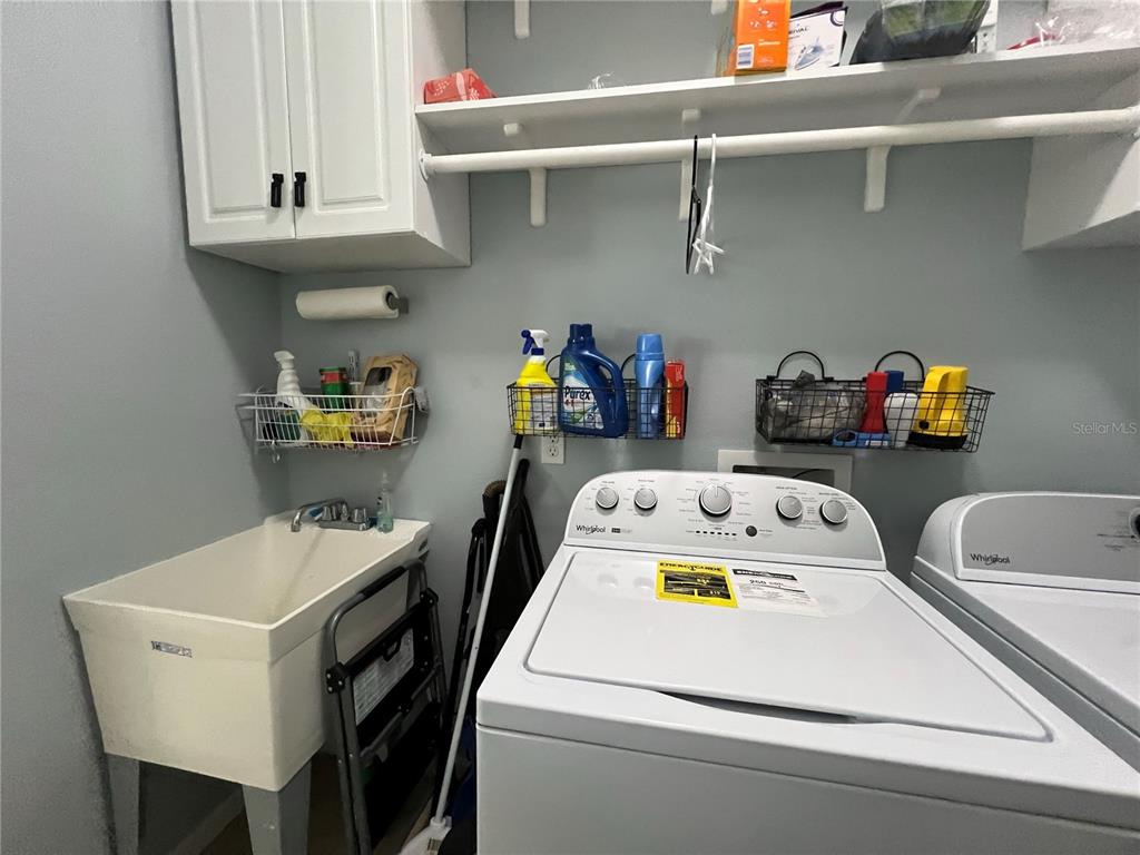 4419 Azure Isle Way Kissimmee, FL 34744 - Photo 38 of 39 a utility room with dryer and washer