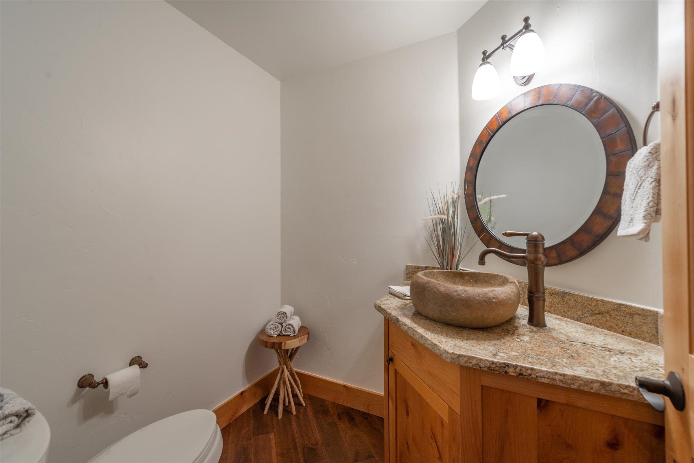 350 Skidder Trail Truckee, CA 96161 - Photo 12 of 20 a bathroom with a granite countertop sink and a mirror