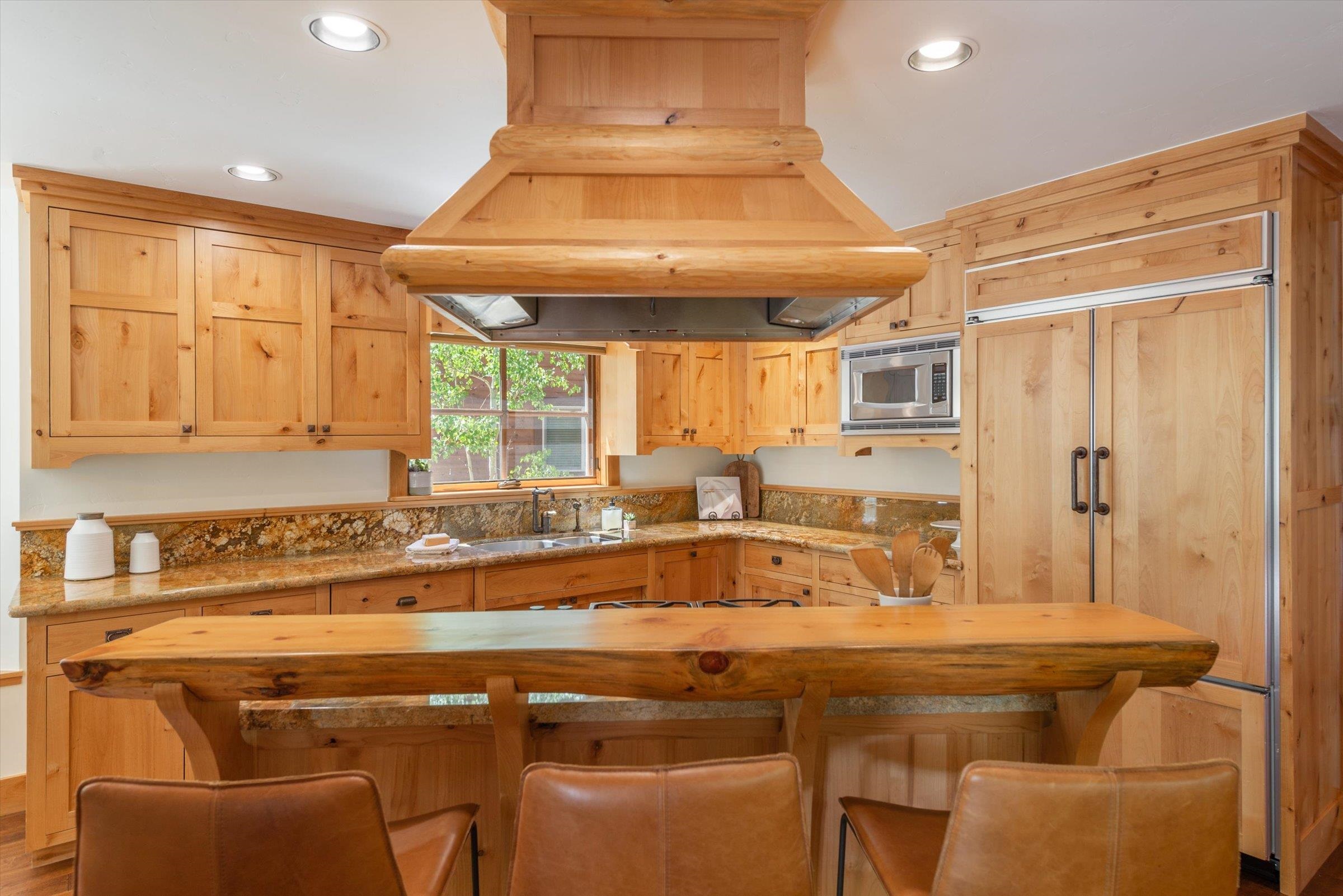 350 Skidder Trail Truckee, CA 96161 - Photo 4 of 20 a view of a kitchen with a table and chairs in it