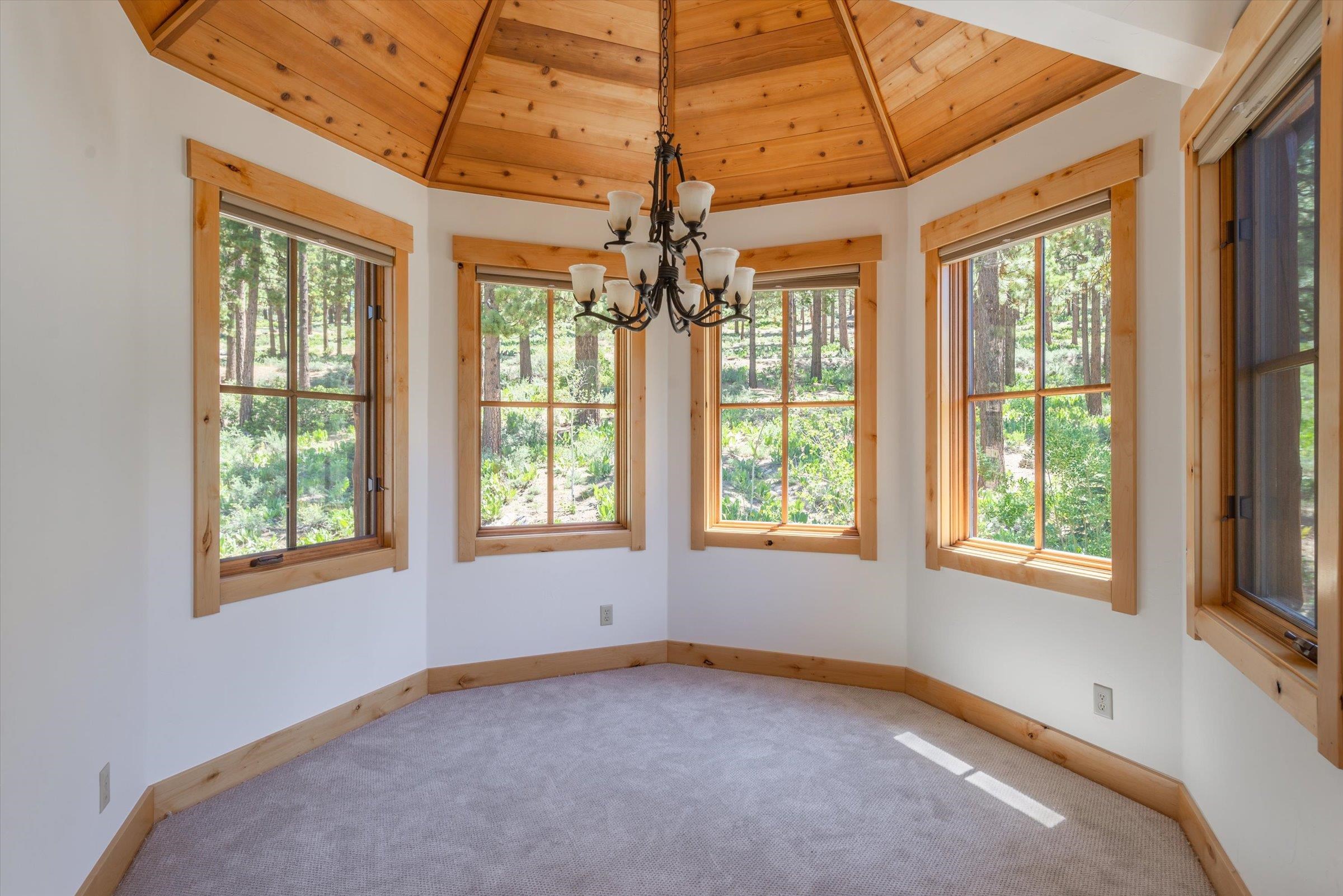350 Skidder Trail Truckee, CA 96161 - Photo 8 of 20 an empty room with chandelier fan and windows