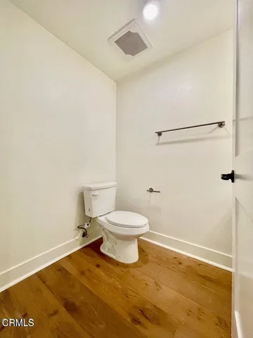 a view of room with wooden floor