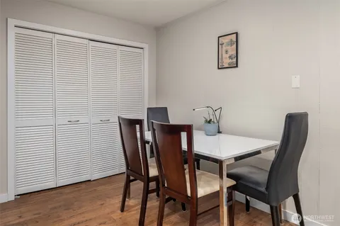 a view of a dining room with furniture and wooden floor