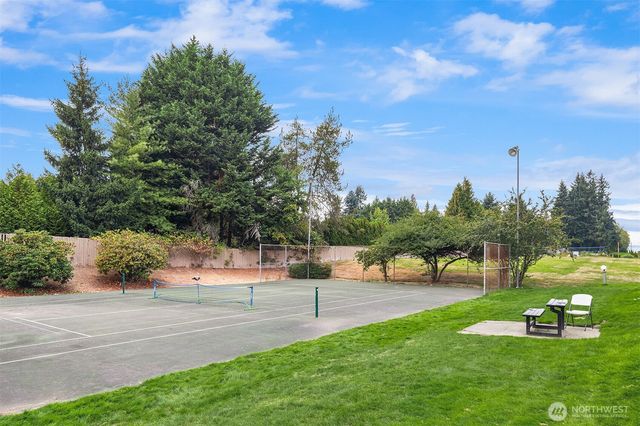 a view of a park with houses