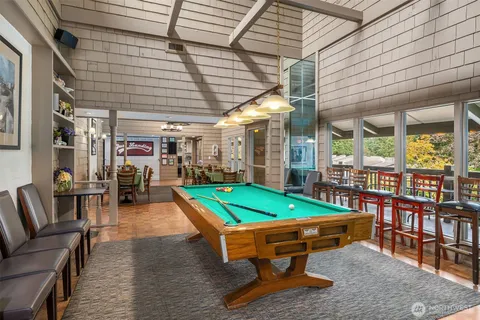 a room with furniture and pool table