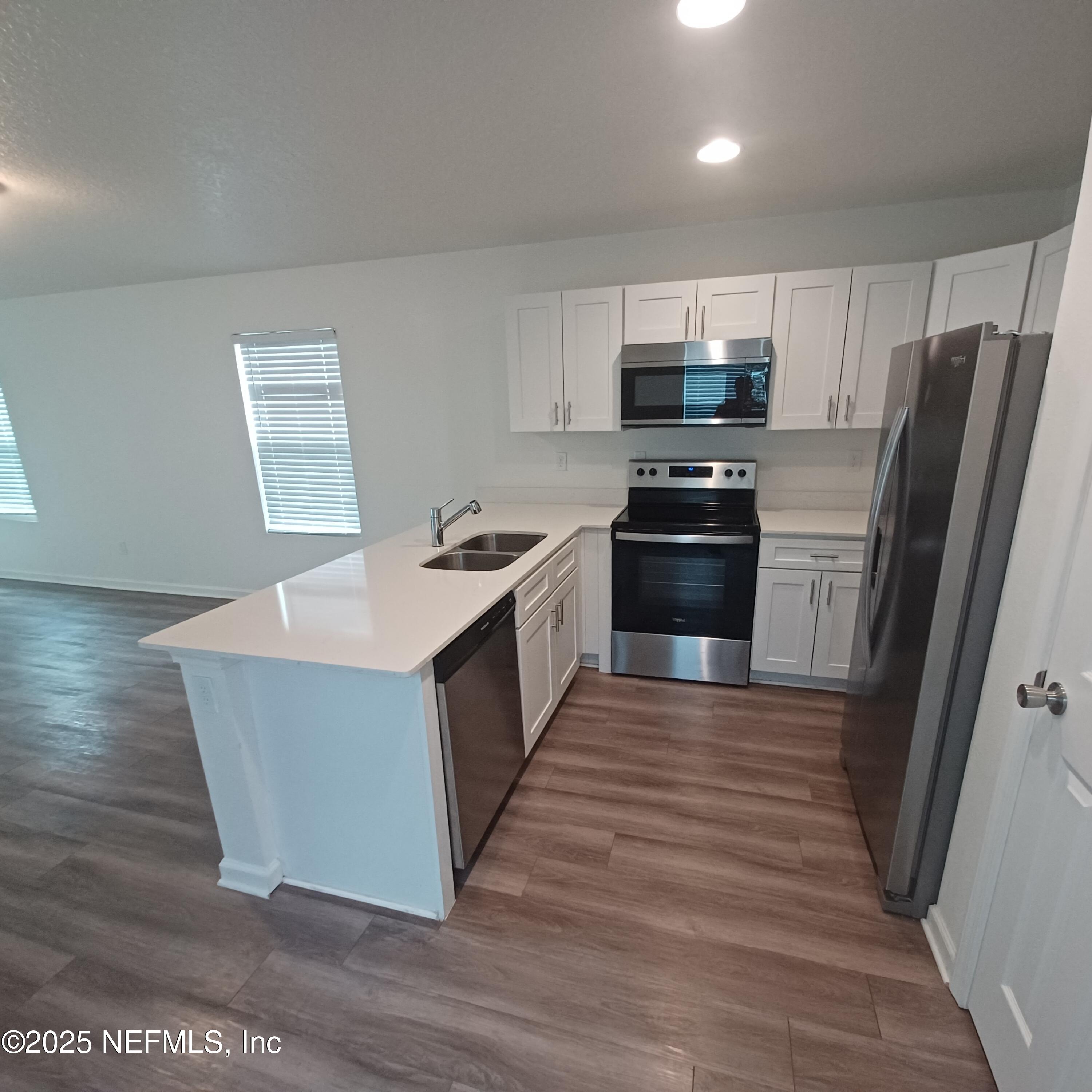 695 Duval Street St. Augustine, FL 32084 - Photo 5 of 20 a kitchen with stainless steel appliances a stove a refrigerator and a stove top oven