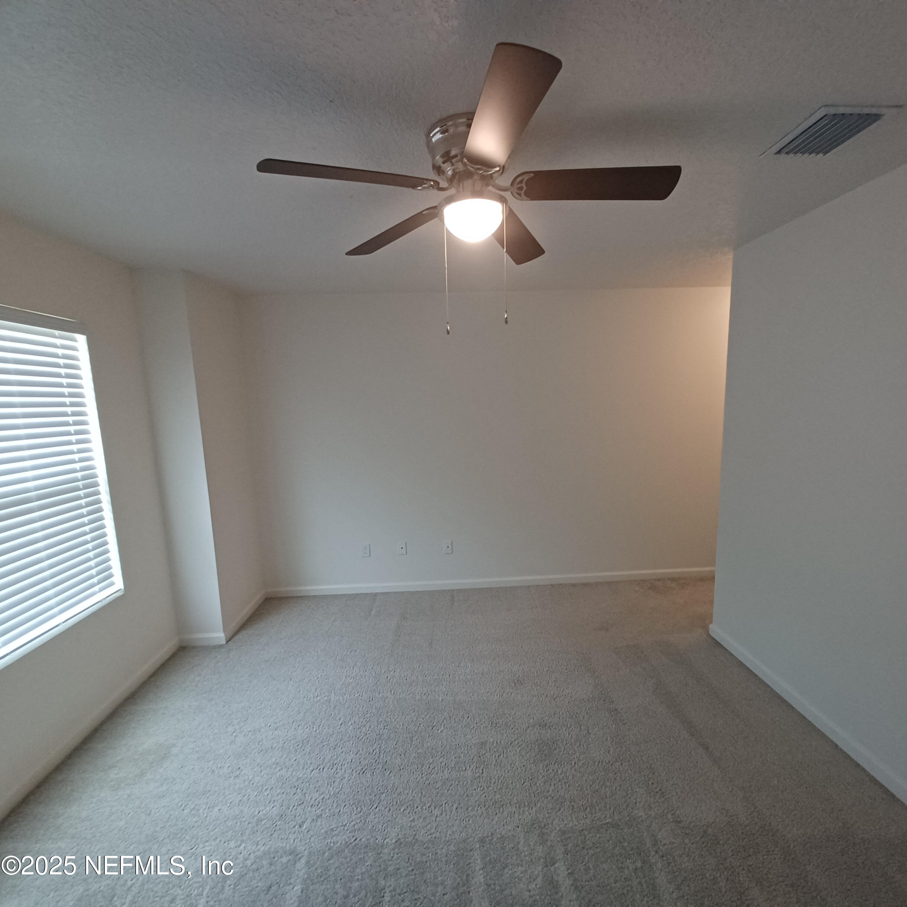 695 Duval Street St. Augustine, FL 32084 - Photo 10 of 20 a view of an empty room with a window