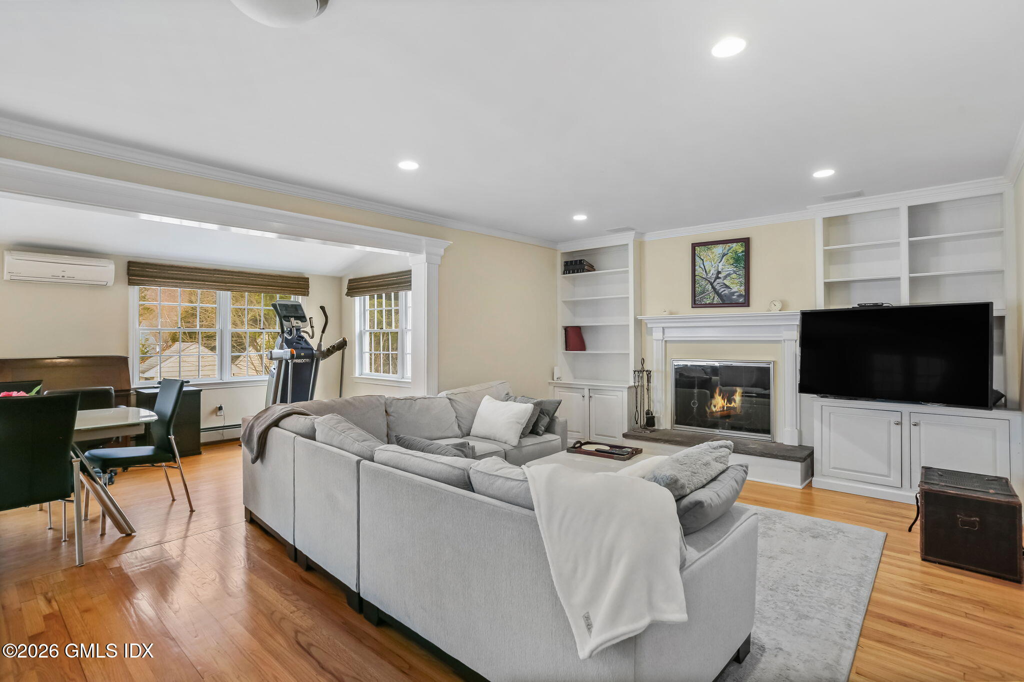 153 Lockwood Road Riverside, CT 06878 - Photo 23 of 58 a living room with fireplace furniture and a flat screen tv
