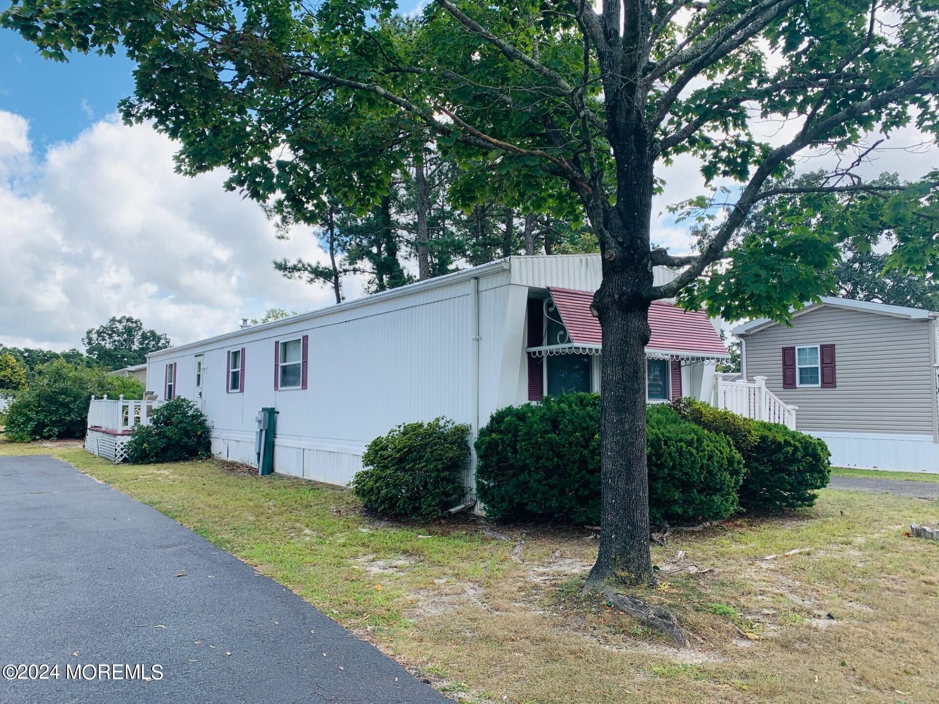 31 Panda Lane Whiting, NJ 08759 - Photo 1 of 16 a view of a house with a tree in front of it