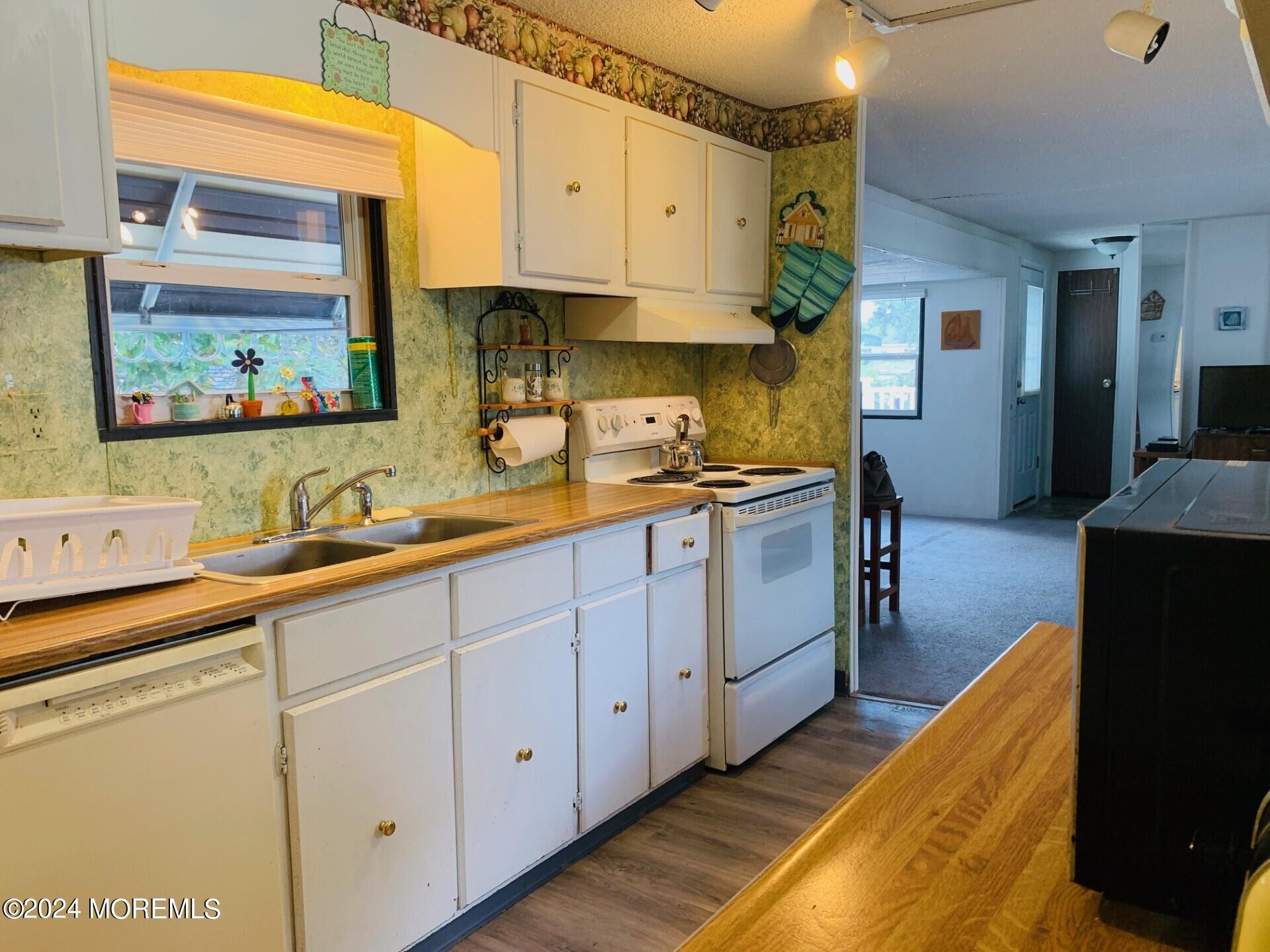 31 Panda Lane Whiting, NJ 08759 - Photo 11 of 16 a kitchen with stainless steel appliances a sink stove and cabinets