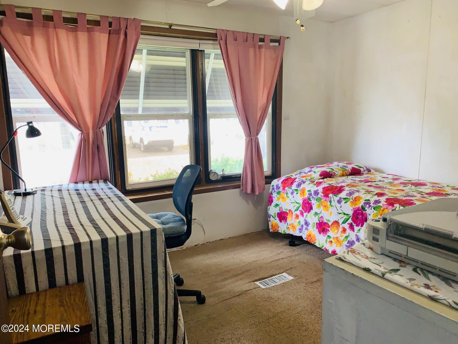31 Panda Lane Whiting, NJ 08759 - Photo 12 of 16 a bedroom with a bed and a window