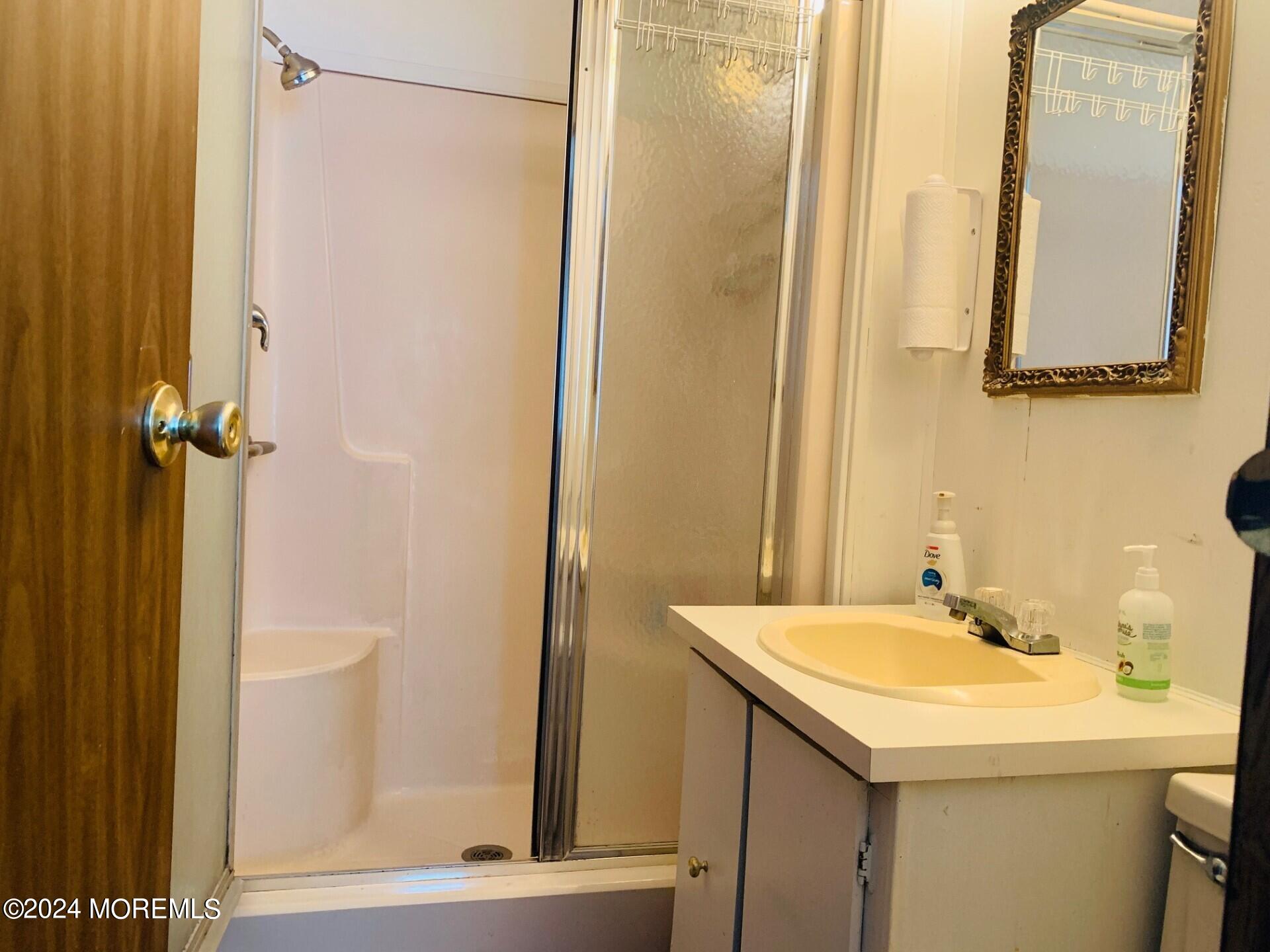 31 Panda Lane Whiting, NJ 08759 - Photo 13 of 16 a bathroom with a sink and a mirror