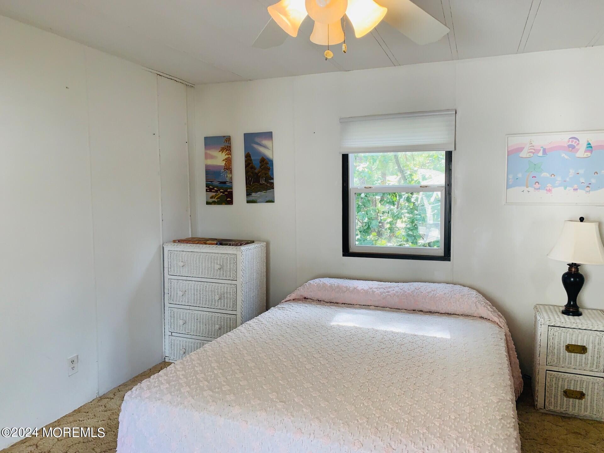 31 Panda Lane Whiting, NJ 08759 - Photo 15 of 16 a bedroom with a bed and a window