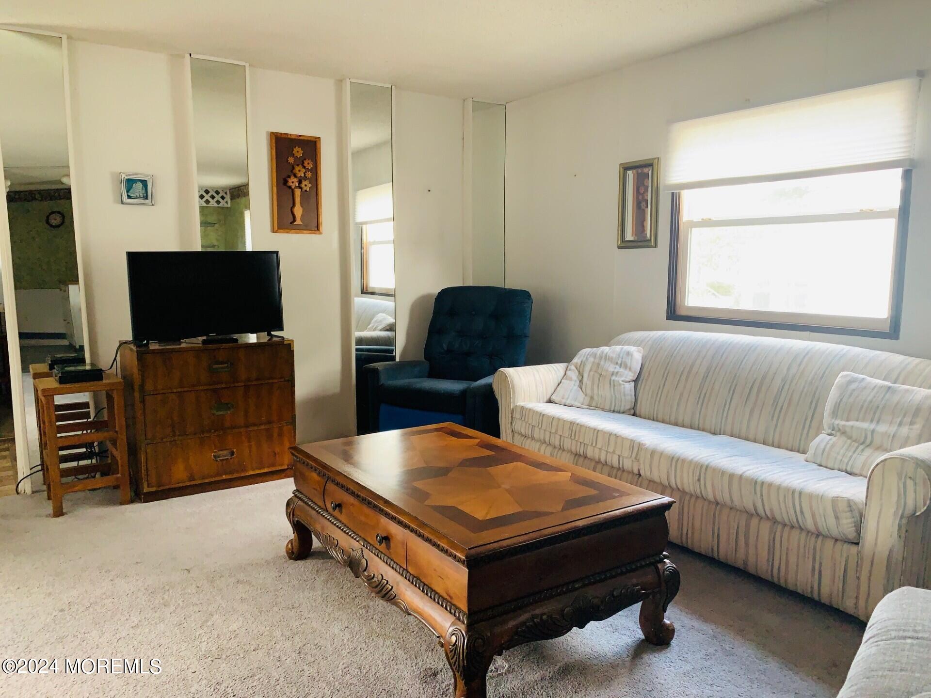 31 Panda Lane Whiting, NJ 08759 - Photo 4 of 16 a living room with furniture and a flat screen tv