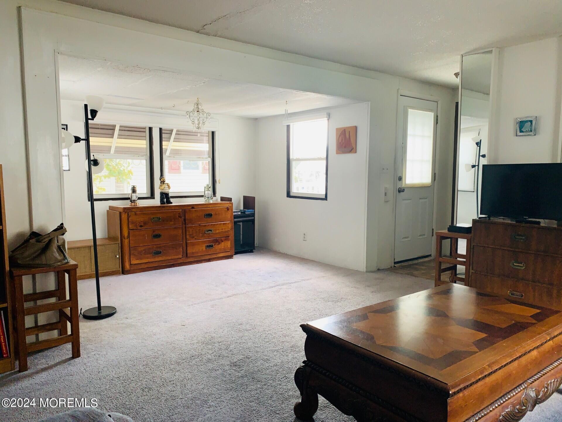 31 Panda Lane Whiting, NJ 08759 - Photo 5 of 16 a living room with furniture and a flat screen tv