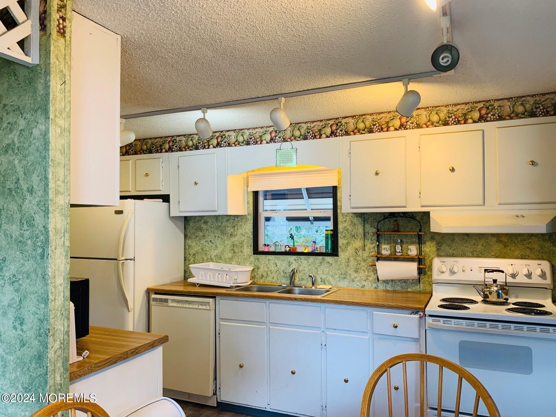 31 Panda Lane Whiting, NJ 08759 - Photo 10 of 16 a kitchen with stainless steel appliances granite countertop a sink and cabinets