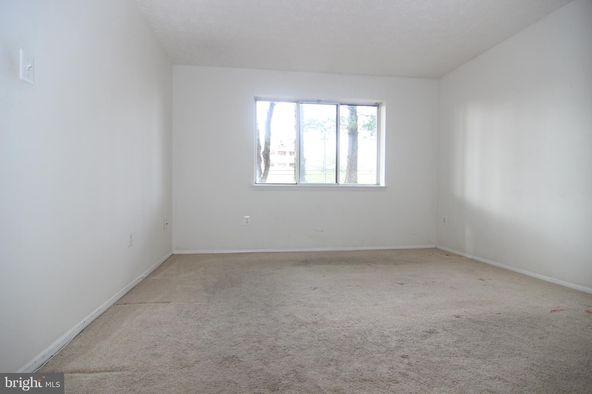 650 Heather Ridge Drive, Unit 12C Frederick, MD 21702 - Photo 23 of 37 Master Bedroom w/Large Window & 2 Walk-in Closets