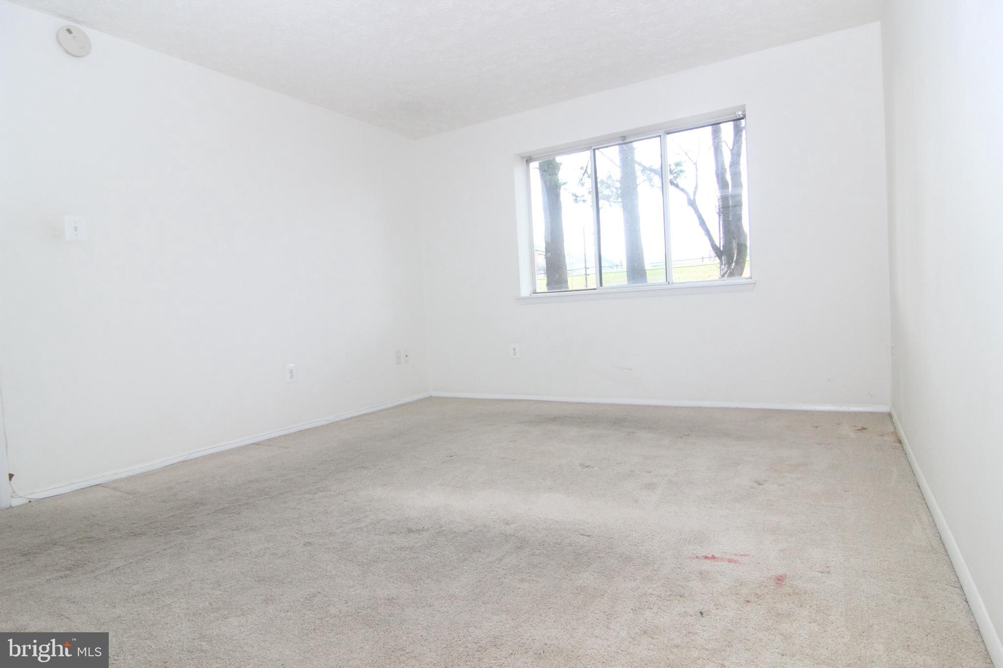 650 Heather Ridge Drive, Unit 12C Frederick, MD 21702 - Photo 24 of 37 Master Bedroom w/Large Window & 2 Walk-in Closets