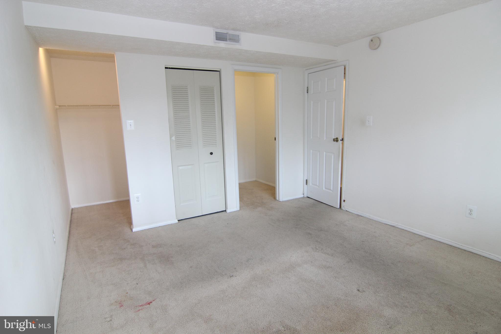 650 Heather Ridge Drive, Unit 12C Frederick, MD 21702 - Photo 25 of 37 Master Bedroom w/Large Window & 2 Walk-in Closets