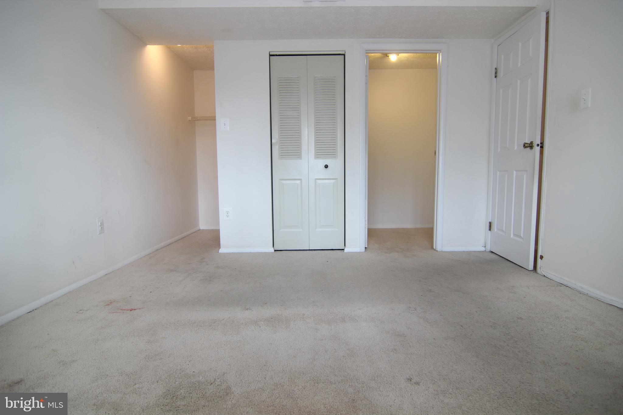 650 Heather Ridge Drive, Unit 12C Frederick, MD 21702 - Photo 26 of 37 Master Bedroom w/Large Window & 2 Walk-in Closets