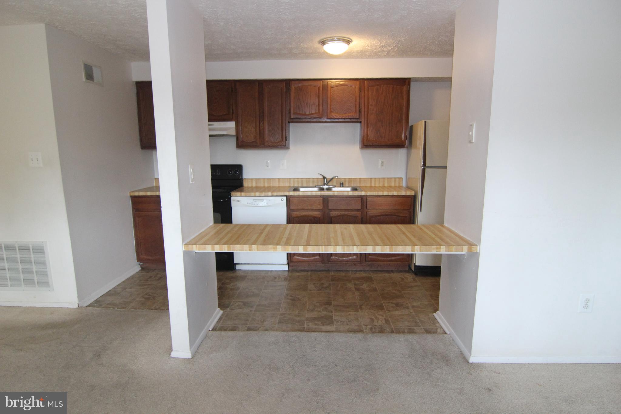 650 Heather Ridge Drive, Unit 12C Frederick, MD 21702 - Photo 6 of 37 Bright Sunlit kitchen with lots of counter space.