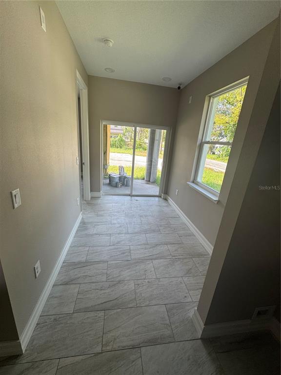 5238 2nd Street Orlando, FL 32810 - Photo 12 of 19 a view of hallway with windows