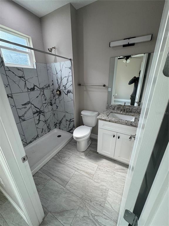 5238 2nd Street Orlando, FL 32810 - Photo 15 of 19 a bathroom with a sink toilet and shower