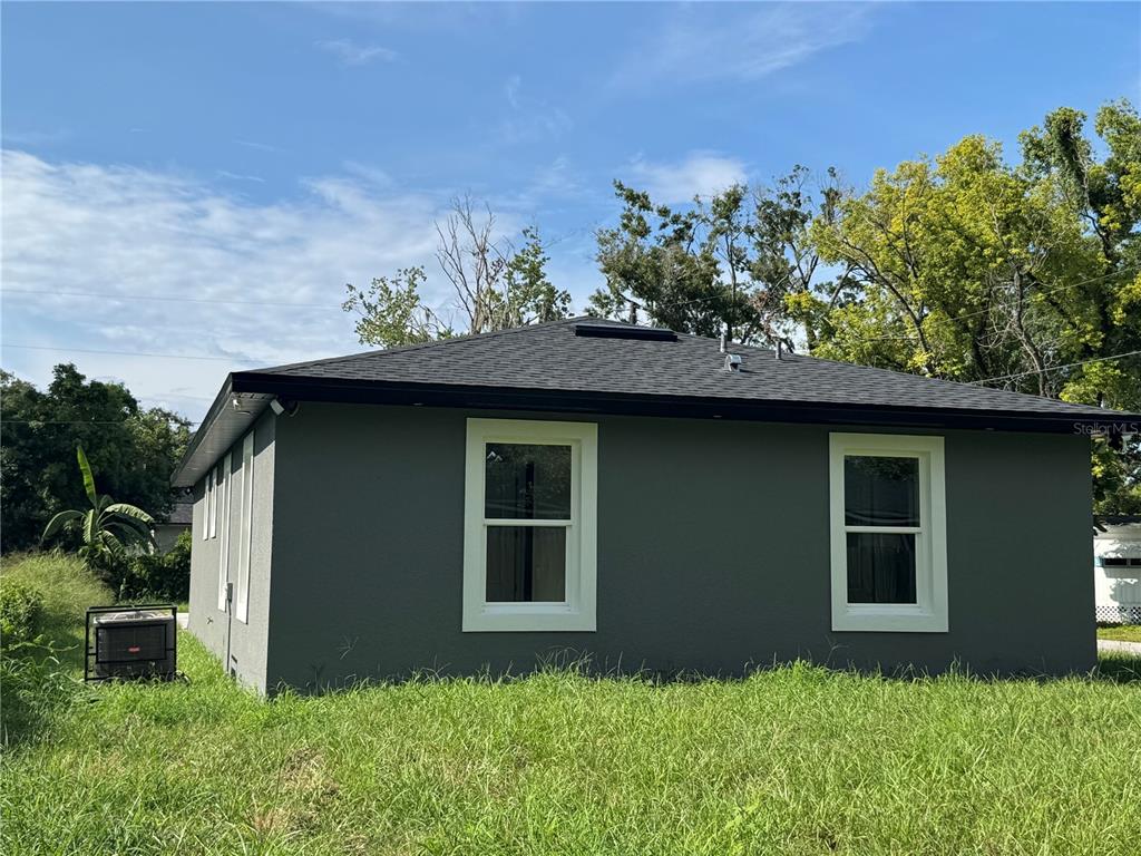 5238 2nd Street Orlando, FL 32810 - Photo 2 of 19 a backyard of a house with lots of green space