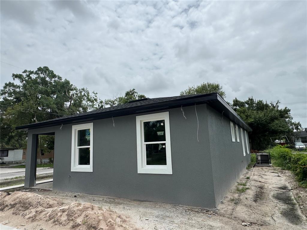 5238 2nd Street Orlando, FL 32810 - Photo 3 of 19 a house with trees in the background