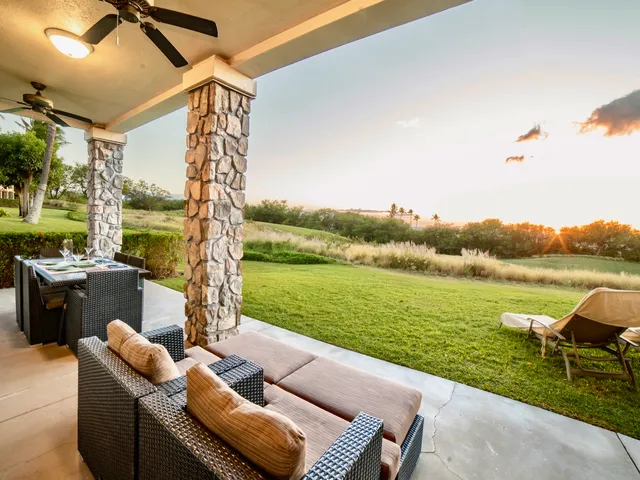 a view of a garden with lawn chairs