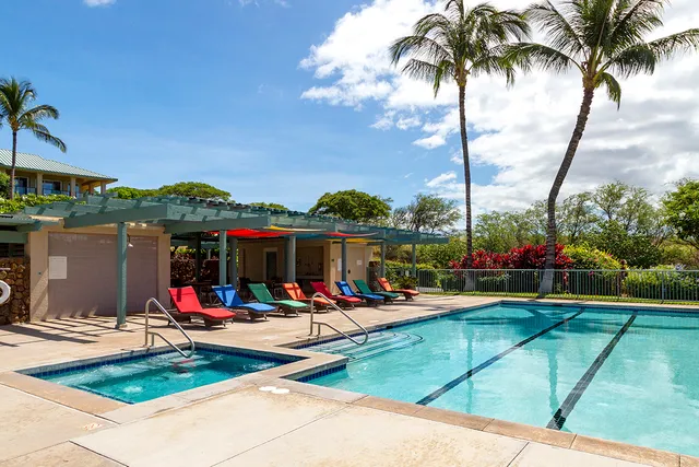 a front view of a house with a tree