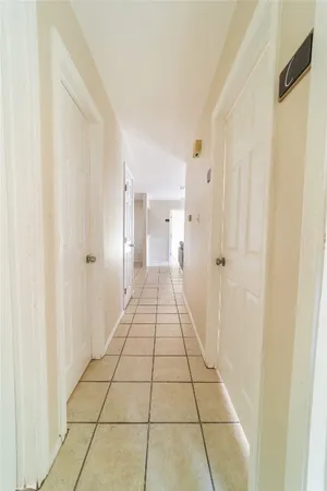 a living room with kitchen island granite countertop furniture and a chandelier