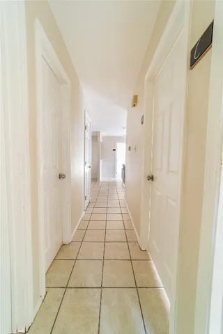 a living room with kitchen island granite countertop furniture and a chandelier