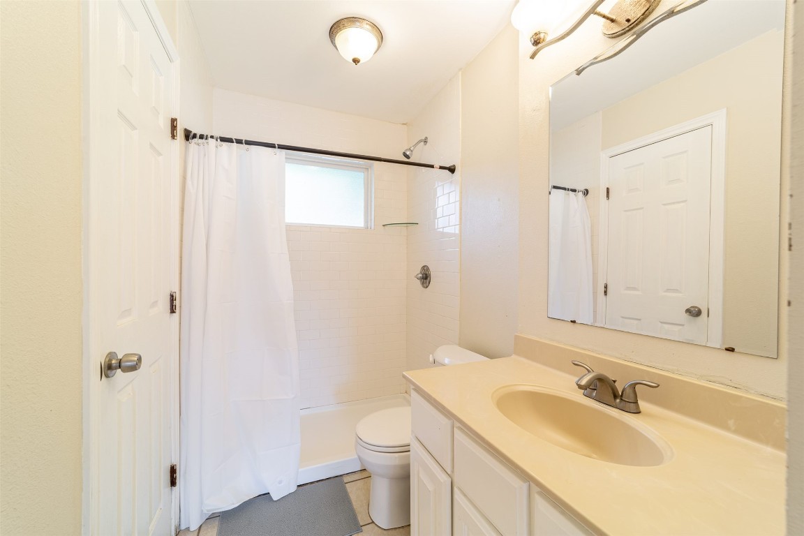 1738 Rutland Drive, Unit A Austin, TX 78758 - Photo 20 of 30 a bathroom with a sink toilet and shower