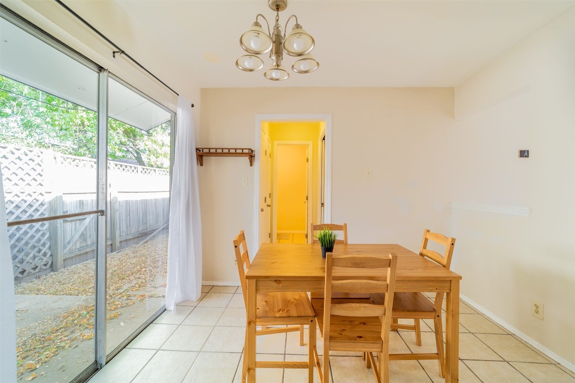 1738 Rutland Drive, Unit A Austin, TX 78758 - Photo 21 of 30 a dining room with a table and chairs