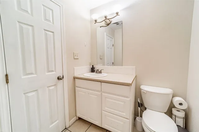 a view of a room with a ceiling fan and a window